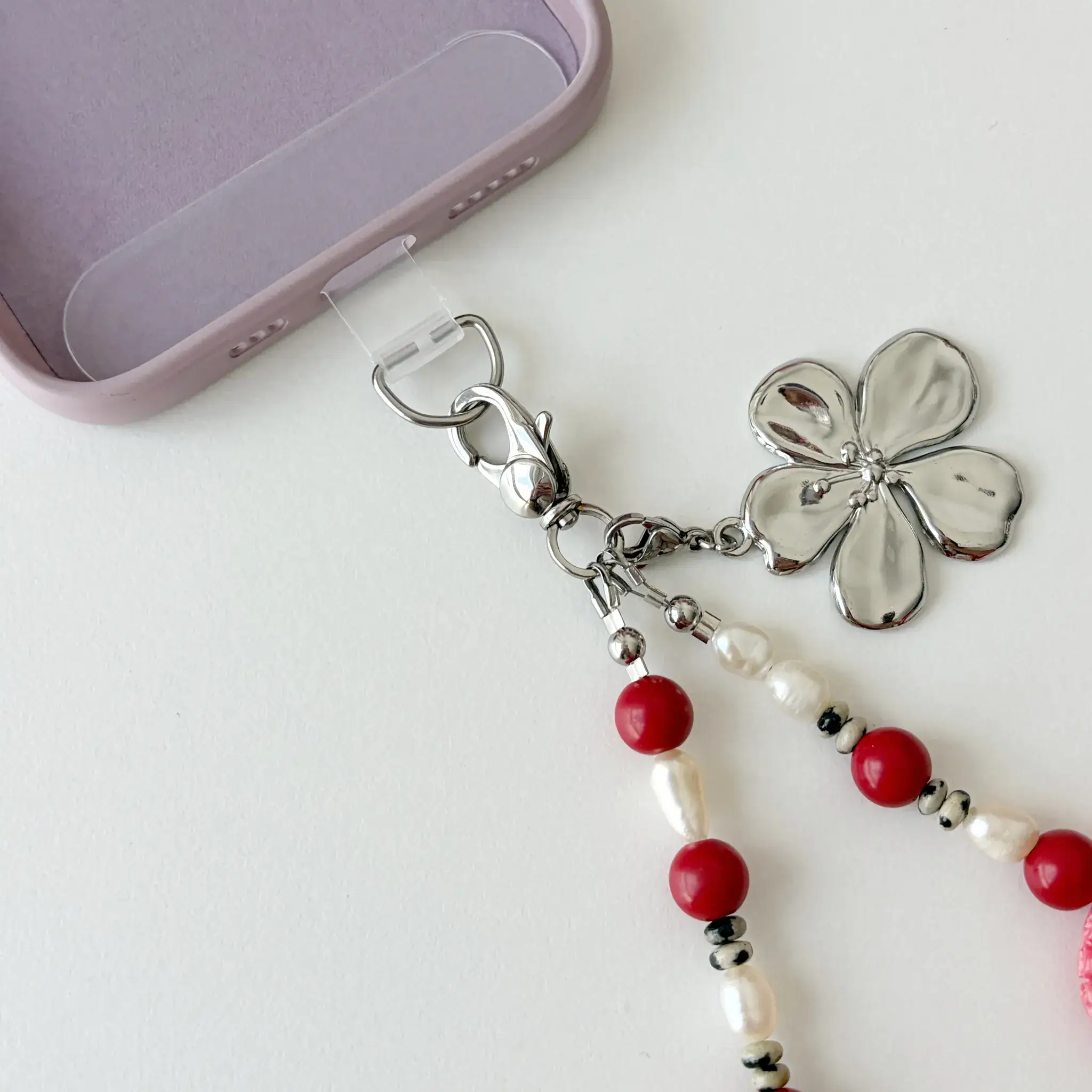 Stainless steel clasp and flower pendant on Coral Seashell phone lanyard