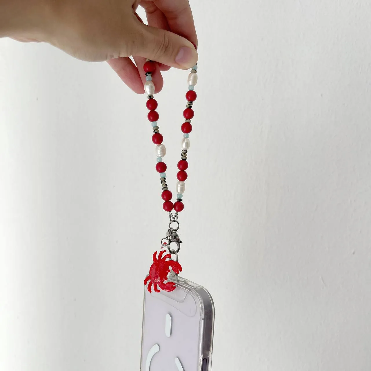 Coral Crab handcrafted beaded phone wristlet main view