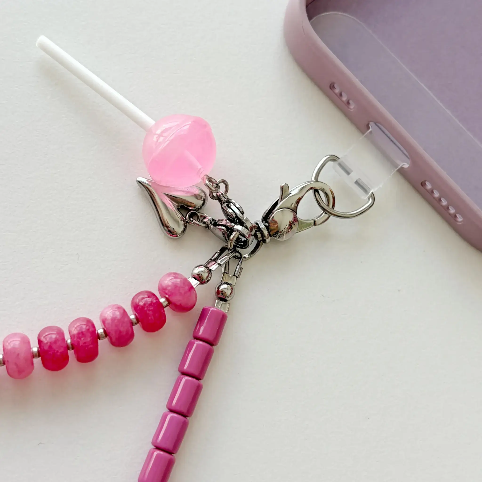 Close-up of stainless steel clasp and charm on Candy Blossom wristlet
