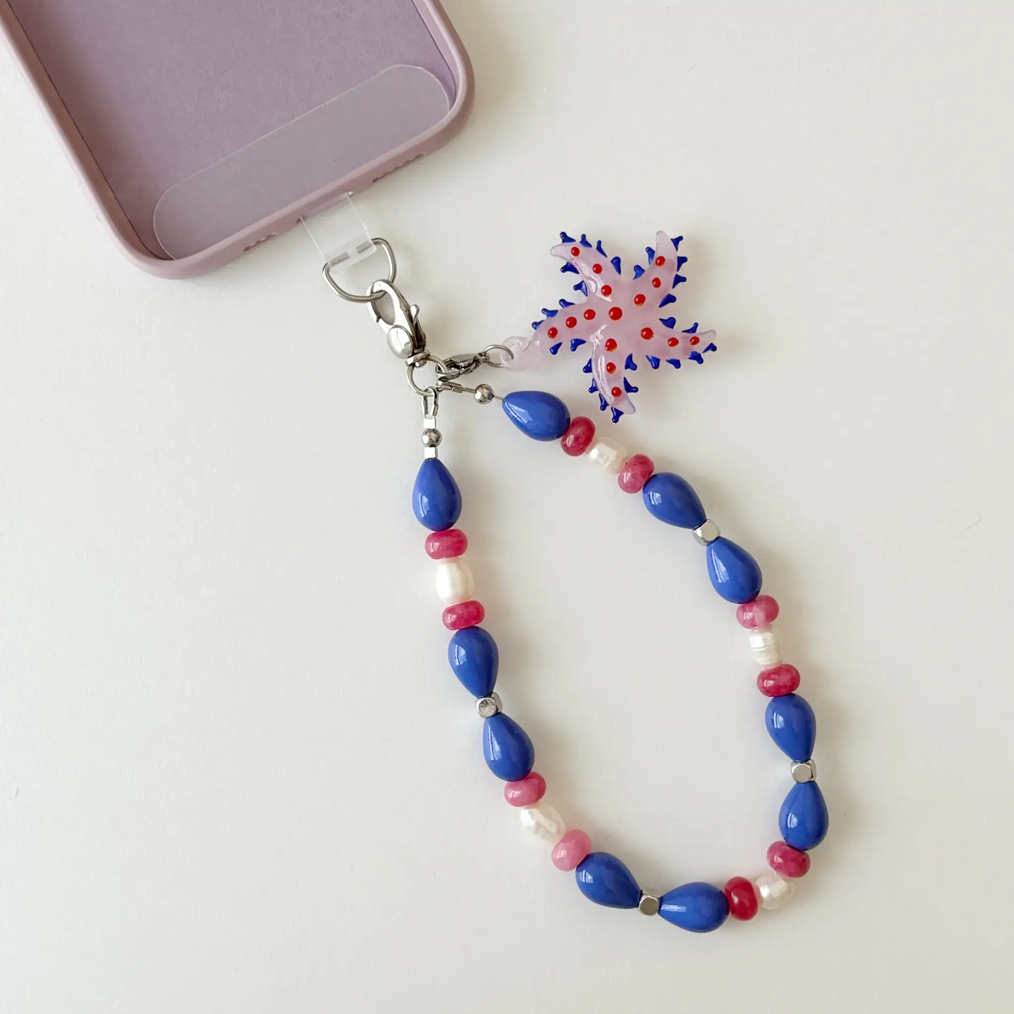 Starfish Bloom handcrafted beaded phone wristlet main view