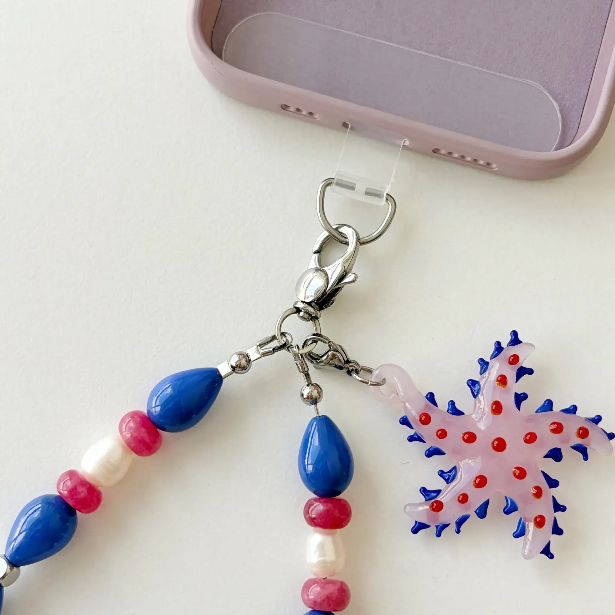 Close-up of glass starfish pendant and clasp on Starfish Bloom wristlet
