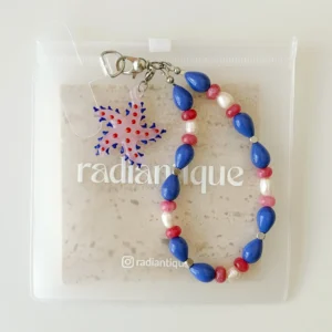 Vertical flat lay view of Starfish Bloom beaded phone strap